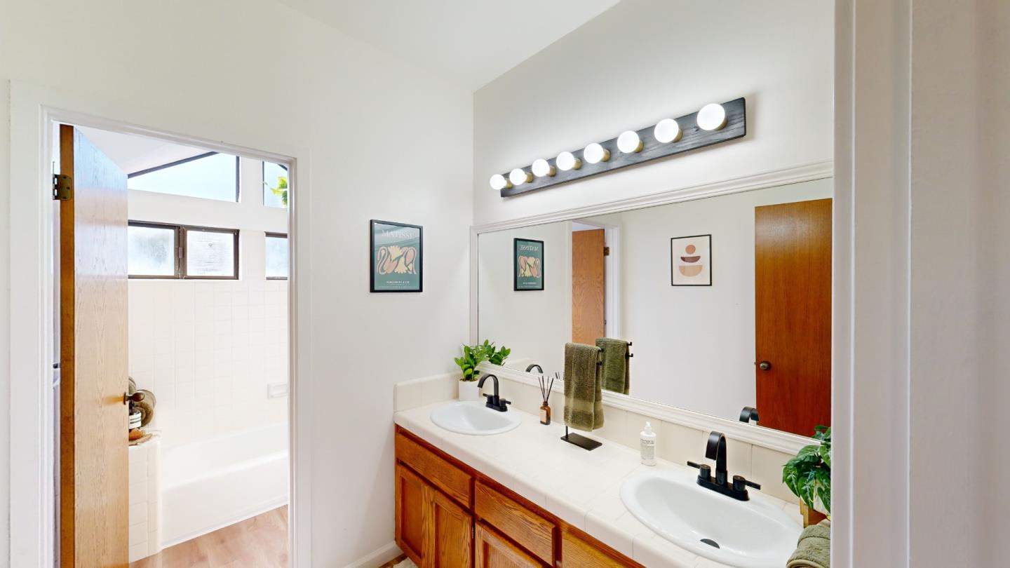 4493 Merlin Way Soquel, CA 95073 - Photo 40 of 52 a bathroom with a sink and a mirror