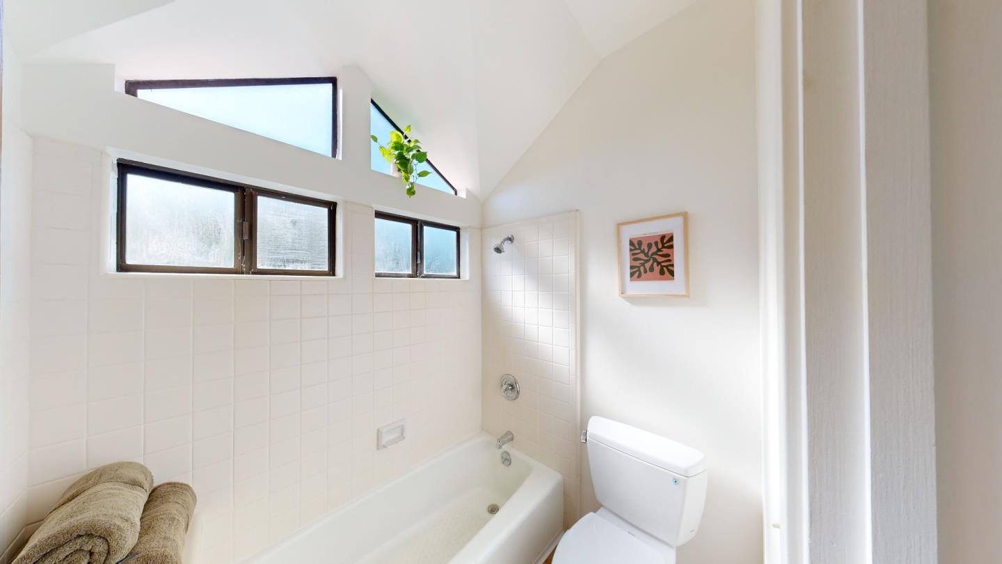 4493 Merlin Way Soquel, CA 95073 - Photo 42 of 52 a bathroom with a toilet and a bathtub