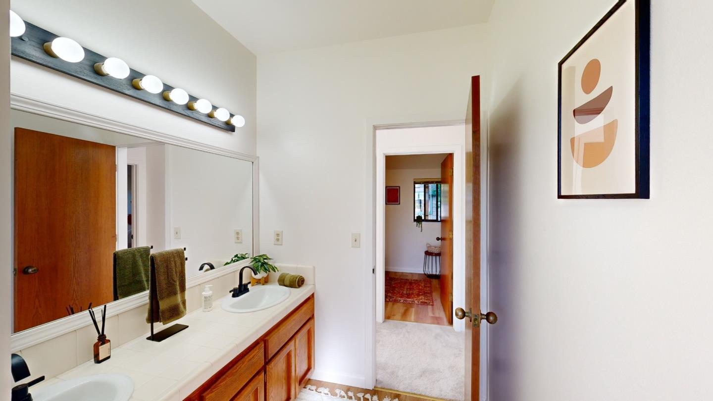 4493 Merlin Way Soquel, CA 95073 - Photo 43 of 52 a bathroom with a sink and a mirror