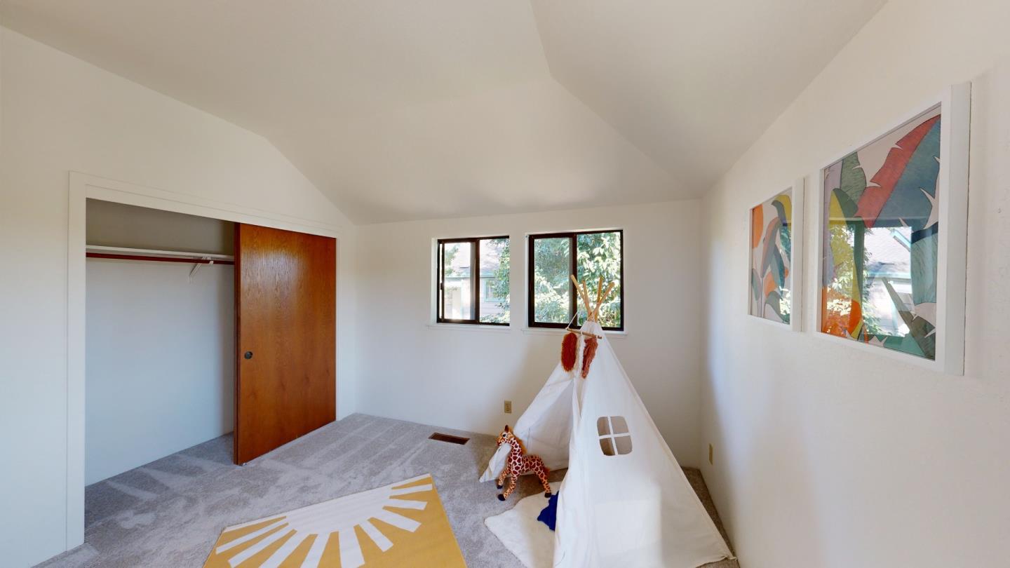 4493 Merlin Way Soquel, CA 95073 - Photo 48 of 52 a view of a bedroom with wooden floor and windows