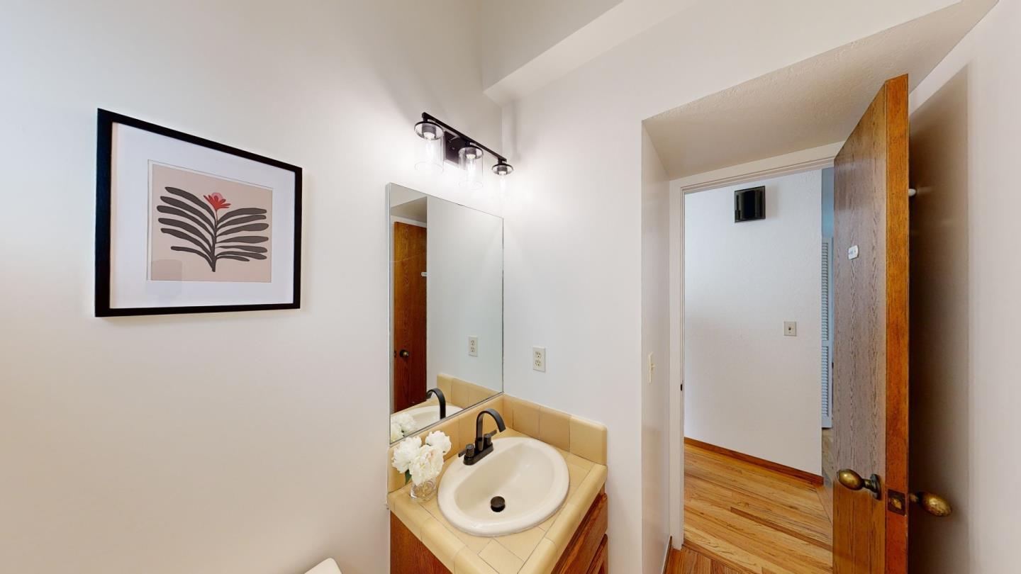 4493 Merlin Way Soquel, CA 95073 - Photo 10 of 52 a bathroom with a sink a mirror and a shower