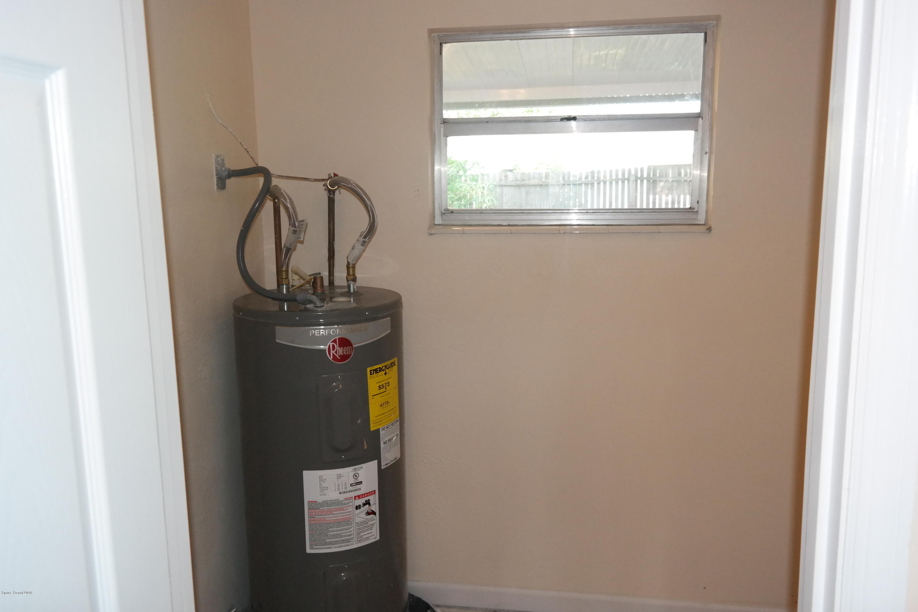 984 Kings Post Road Rockledge, FL 32955 - Photo 16 of 29 Laundry Room off the Kitchen