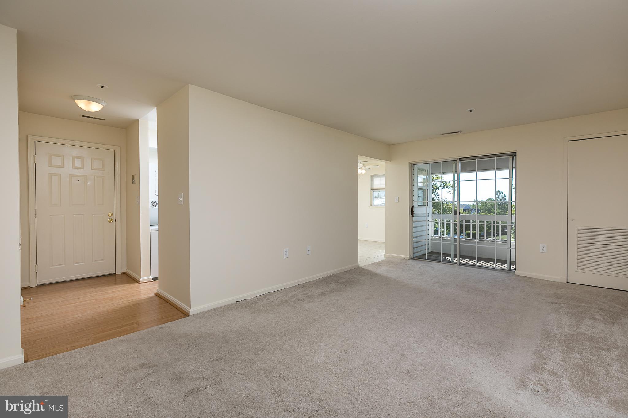 8390 Montgomery Run Road, Unit D Ellicott City, MD 21043 - Photo 2 of 19 Foyer leading to living room and kitchen