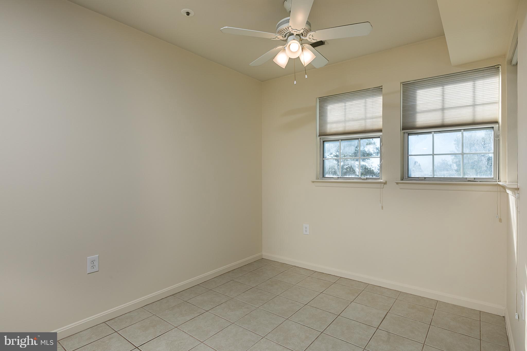8390 Montgomery Run Road, Unit D Ellicott City, MD 21043 - Photo 4 of 19 Ceiling fan light fixture & ceramic tile