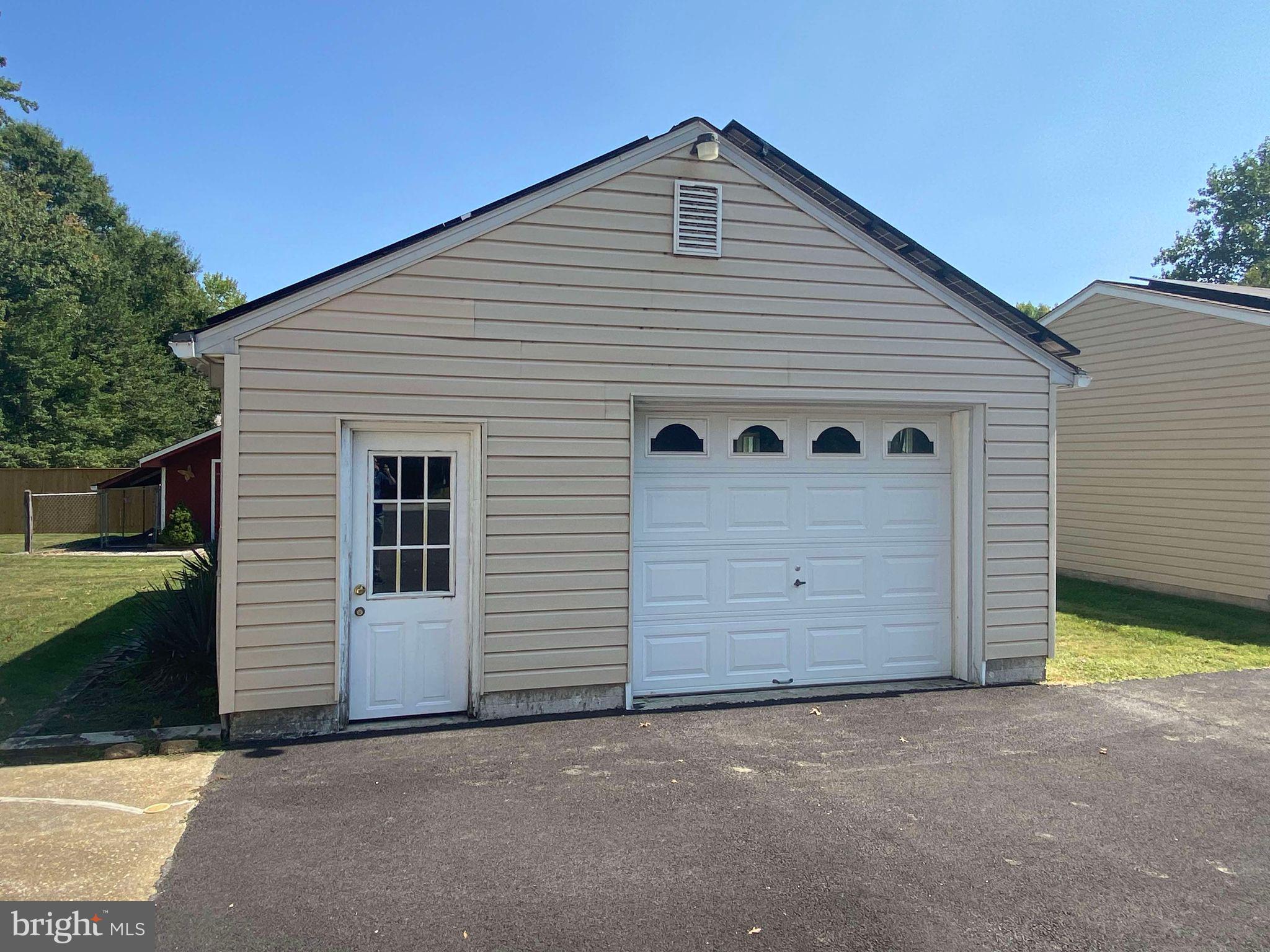 1107 Maple Road Essex, MD 21221 - Photo 20 of 42 a view of a house with a garage