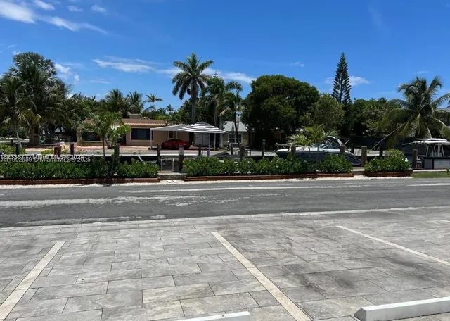 a view of a street with a building in the background