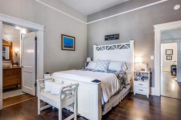 a bedroom with a bed and a table