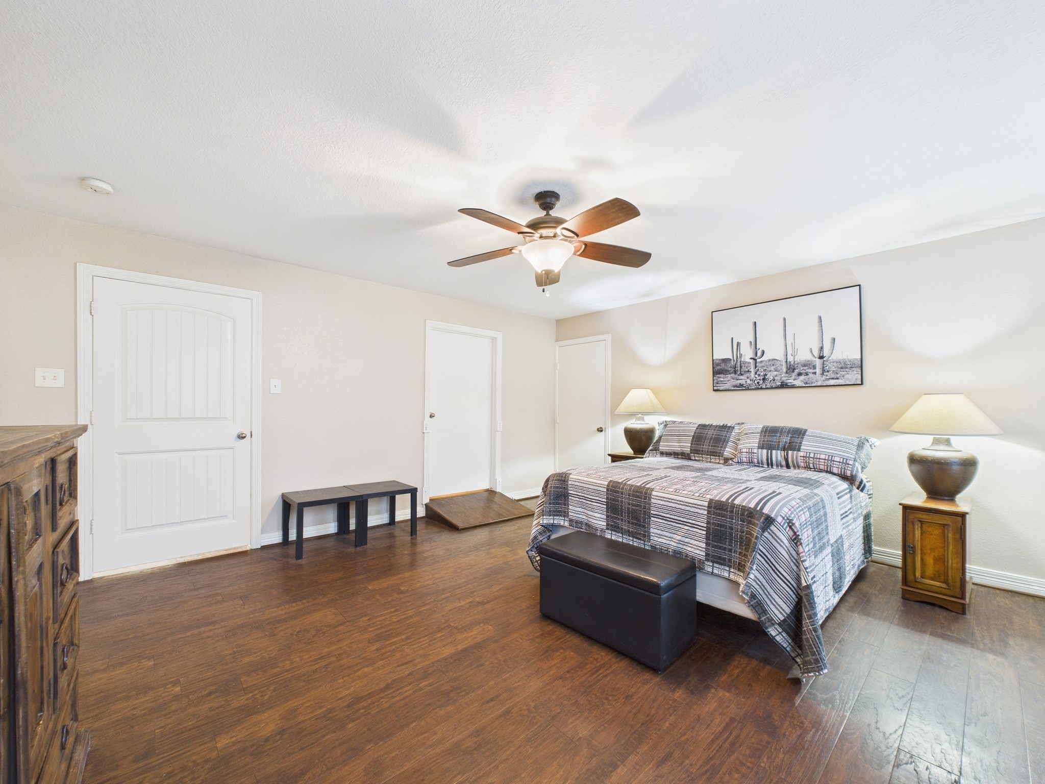 15802 Firetower Road, Unit A Conroe, TX 77306 - Photo 11 of 17 a spacious bedroom with a bed and a table