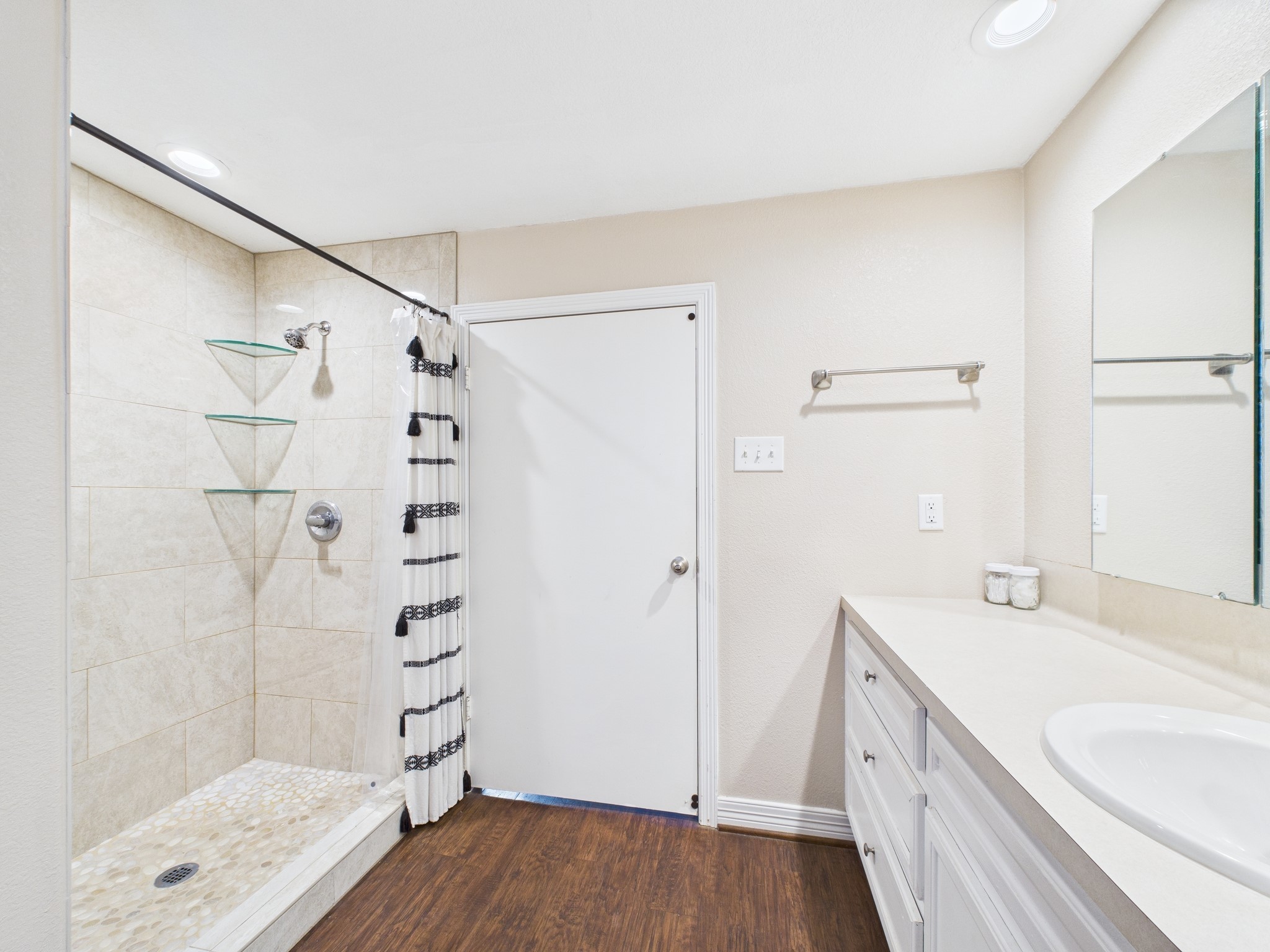 15802 Firetower Road, Unit A Conroe, TX 77306 - Photo 13 of 17 a bathroom with a sink and a shower