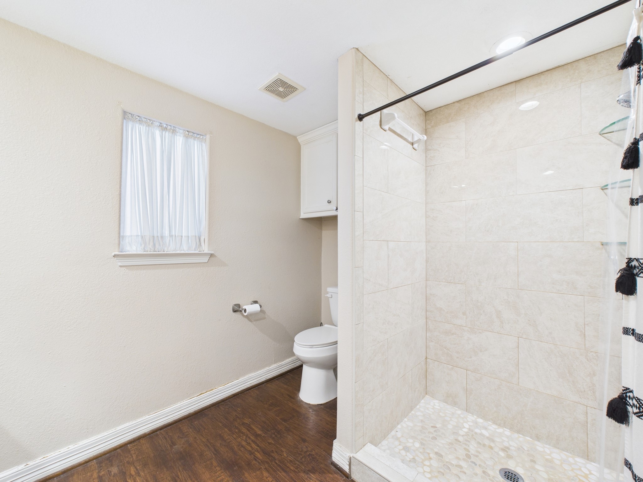 15802 Firetower Road, Unit A Conroe, TX 77306 - Photo 14 of 17 a bathroom with a toilet and a shower