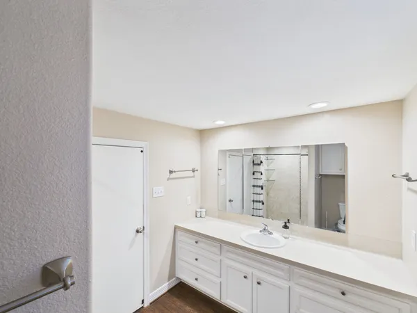 a bathroom with a double vanity sink mirror and double