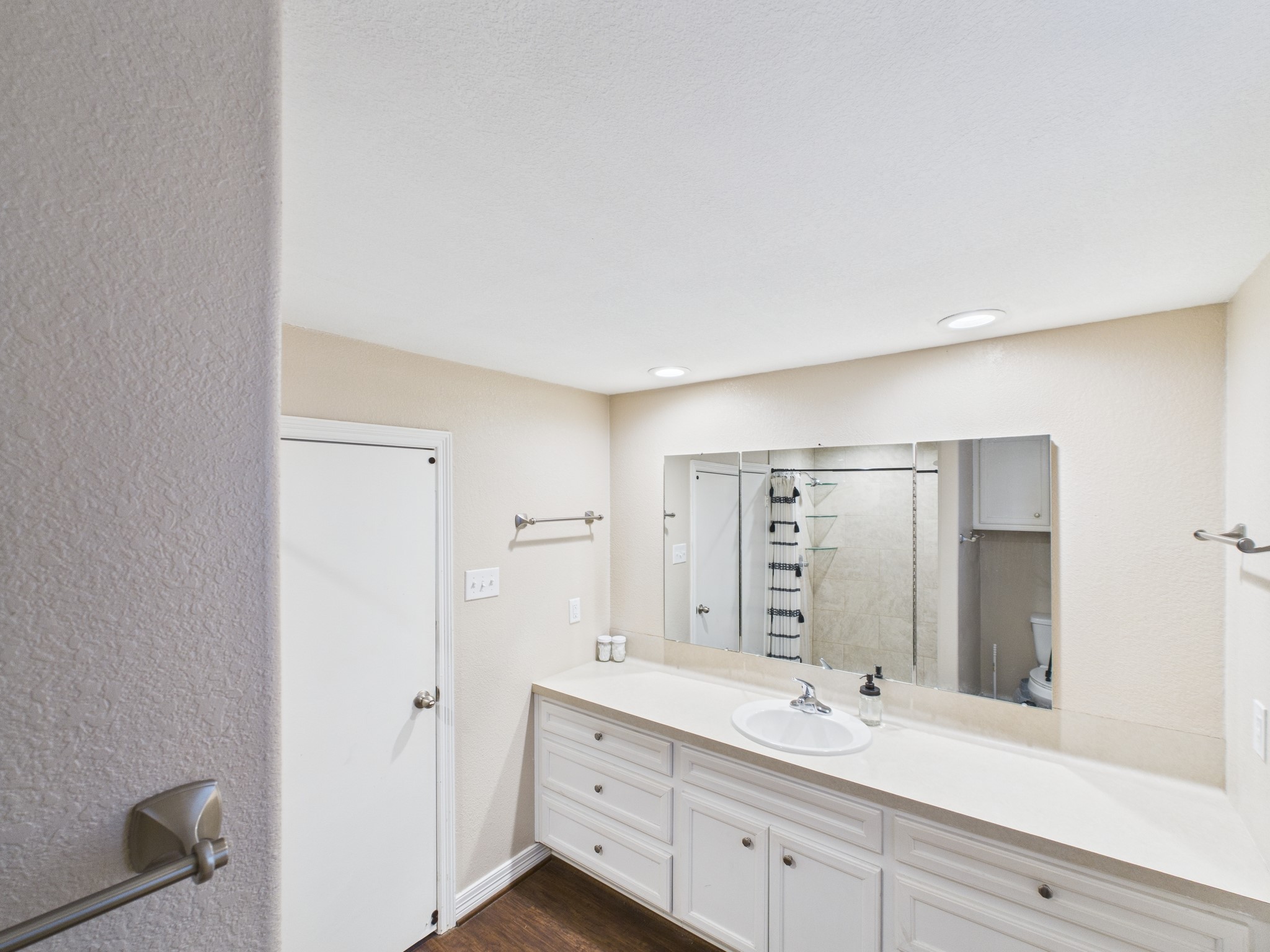 15802 Firetower Road, Unit A Conroe, TX 77306 - Photo 15 of 17 a bathroom with a double vanity sink mirror and double
