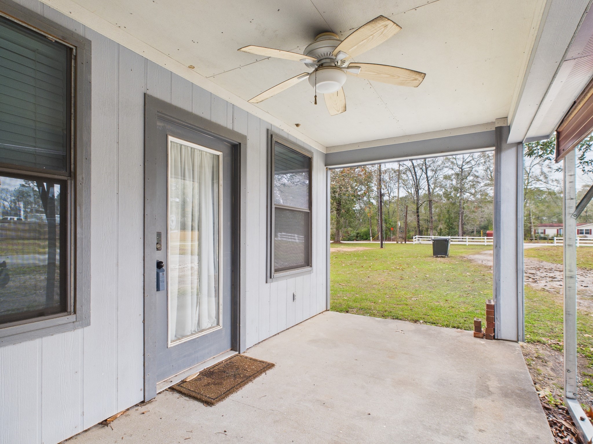 15802 Firetower Road, Unit A Conroe, TX 77306 - Photo 2 of 17 a view of an entryway with a garden