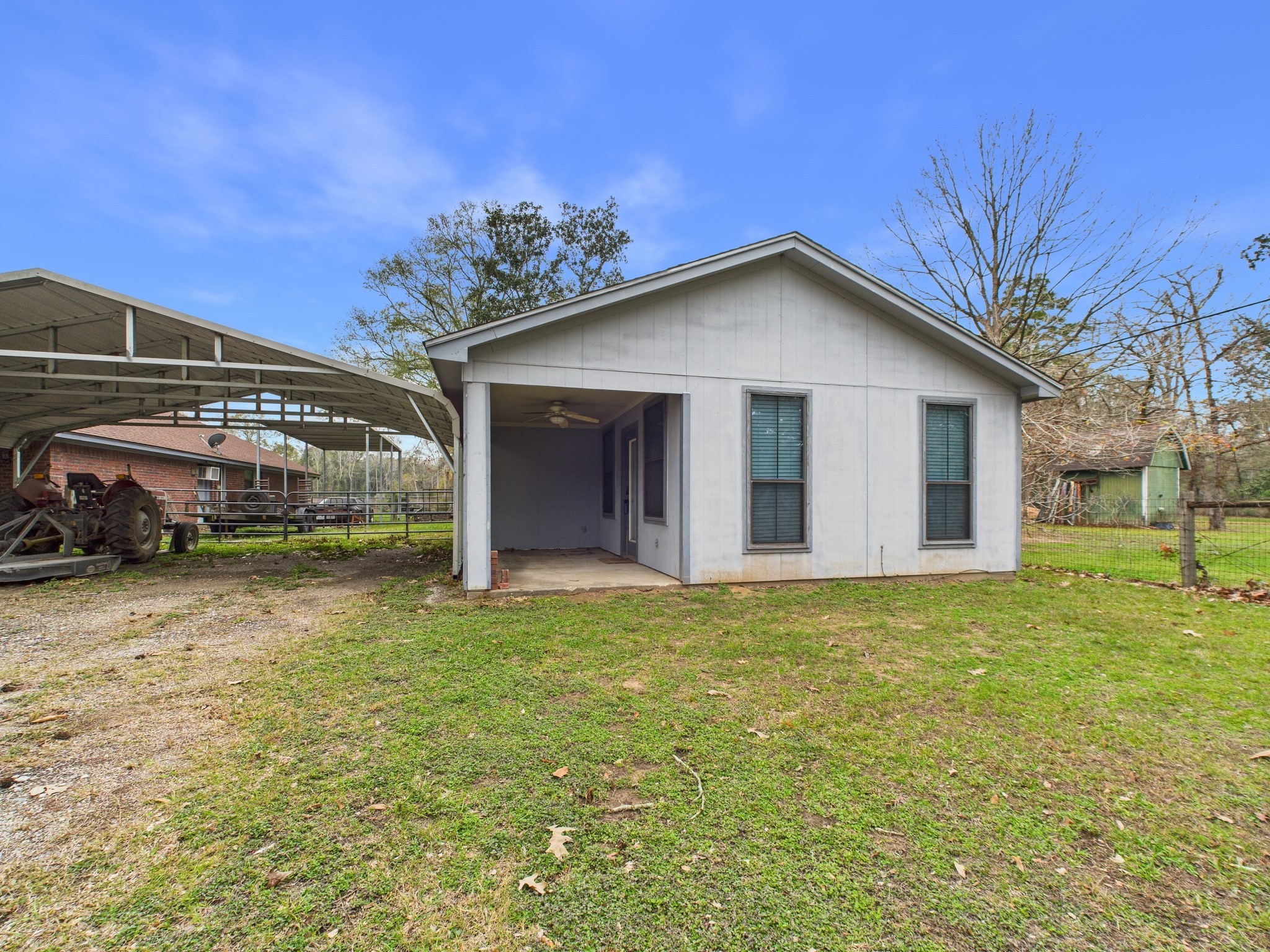 15802 Firetower Road, Unit A Conroe, TX 77306 - Photo 3 of 17 a front view of a house with garden