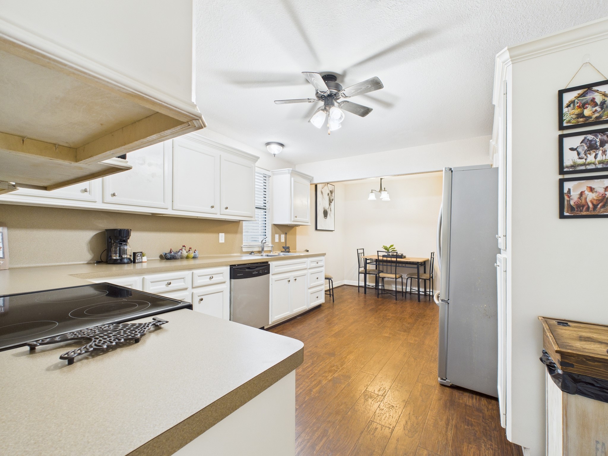 15802 Firetower Road, Unit A Conroe, TX 77306 - Photo 6 of 17 a kitchen with a stove a sink and a refrigerator