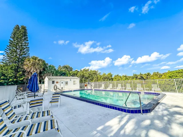a view of a swimming pool with a patio