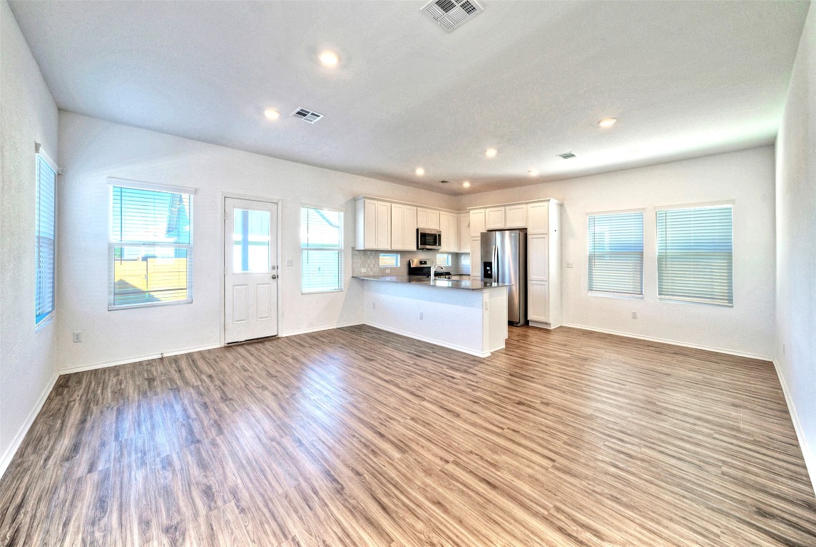 201 Rioja Kyle, TX 78640 - Photo 3 of 21 a view of a kitchen with wooden floor and a kitchen