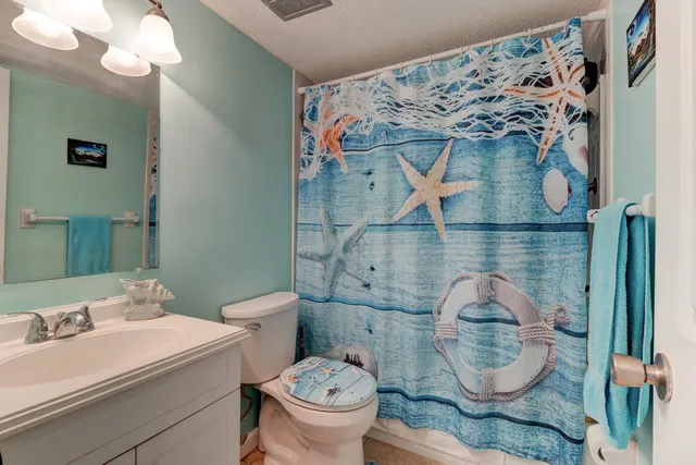 a bathroom with a toilet and a sink