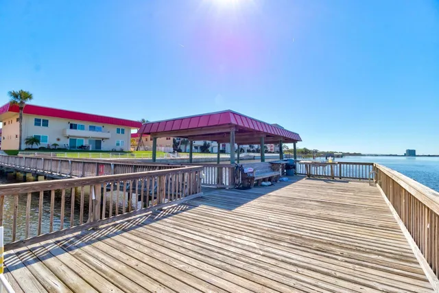 a view of balcony with deck and outdoor seating