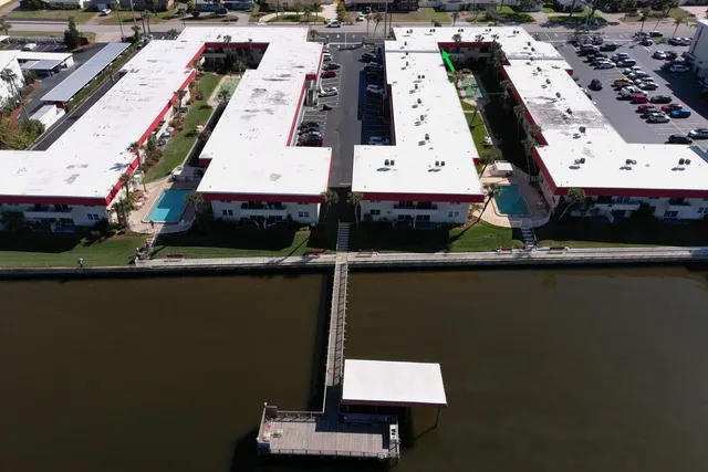 an aerial view of a house with a lake view