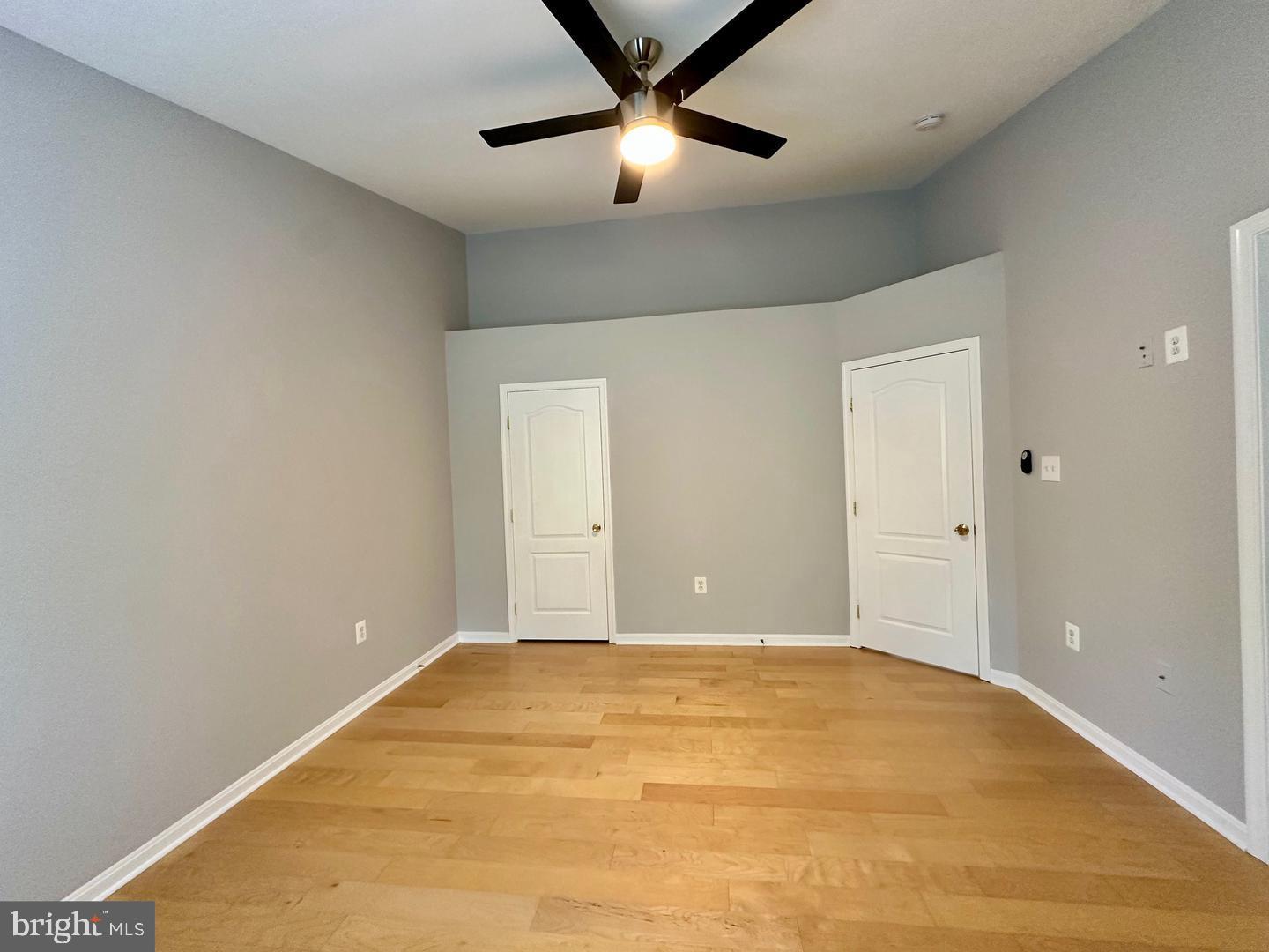 15503 Kennett Square Way Brandywine, MD 20613 - Photo 13 of 32 a view of a big room with a ceiling fan and a window
