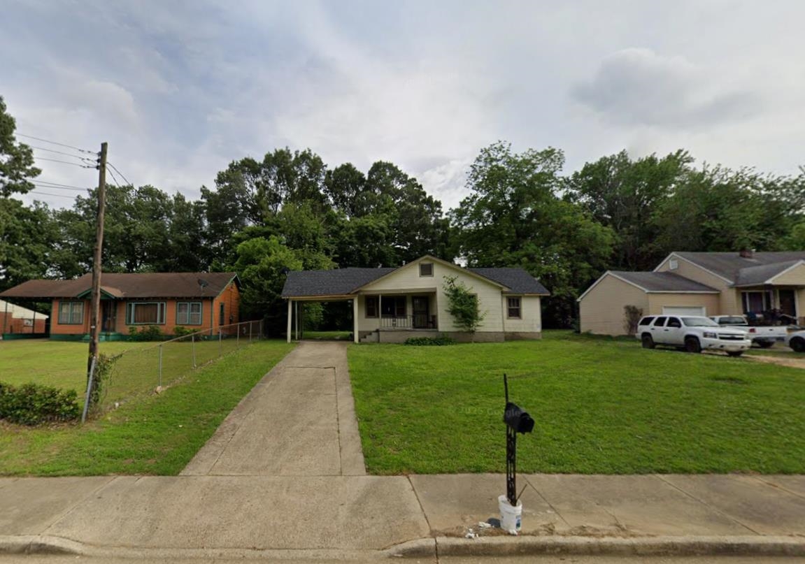 73 East Rollins Road Memphis, TN 38109 - Photo 1 of 1 Ranch-style home featuring concrete driveway and an attached carport