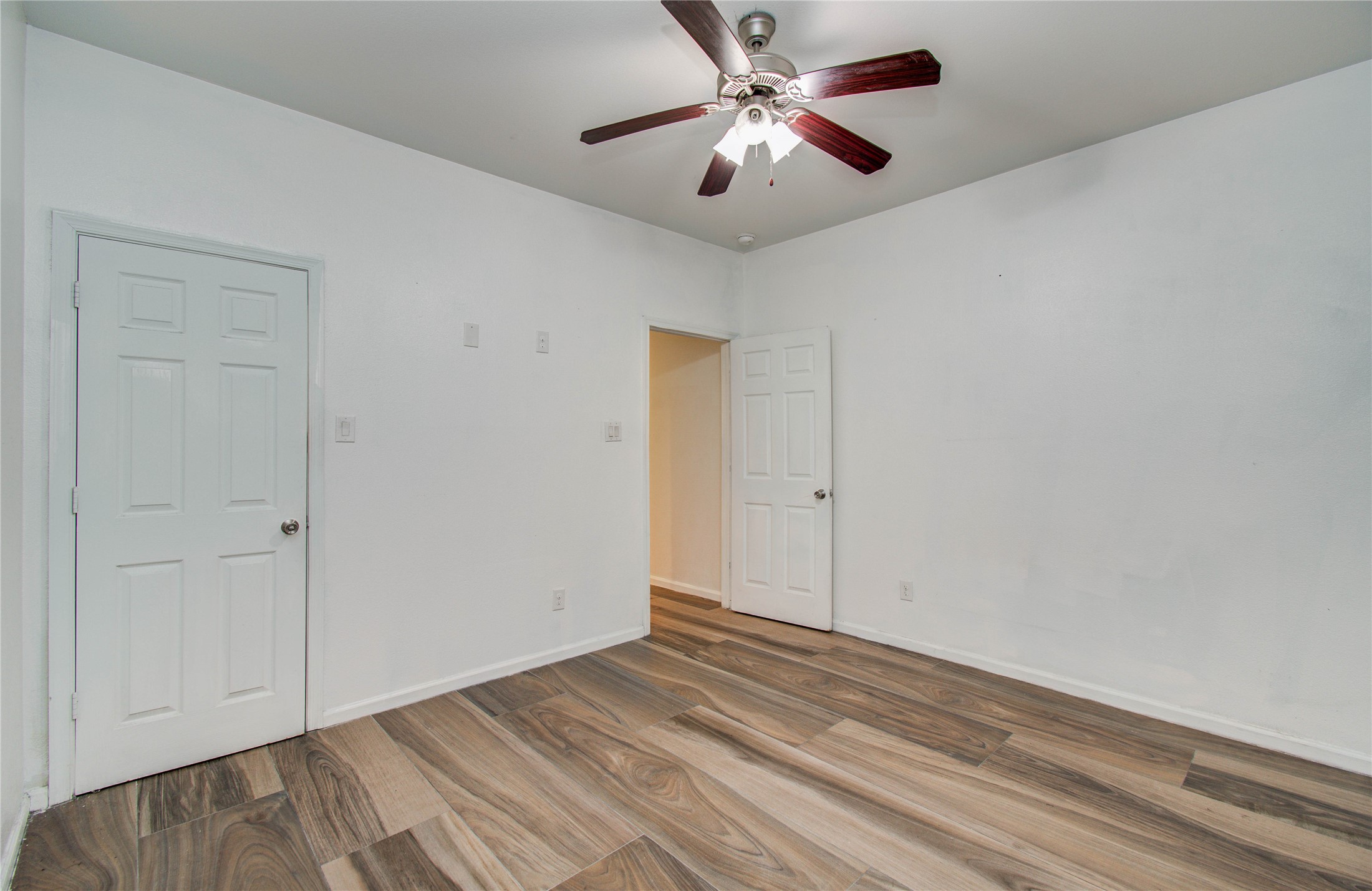 8040 Howton Street, Unit 12 Houston, TX 77028 - Photo 13 of 35 a view of empty room with wooden floor