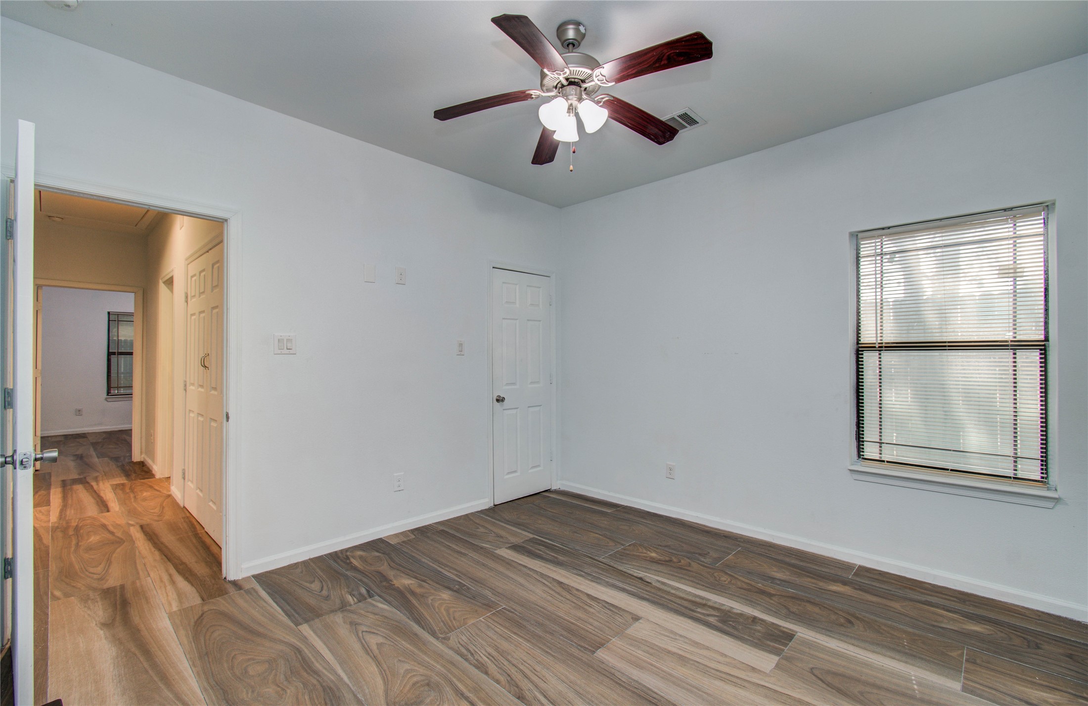 8040 Howton Street, Unit 12 Houston, TX 77028 - Photo 18 of 35 wooden floor in an empty room with a window