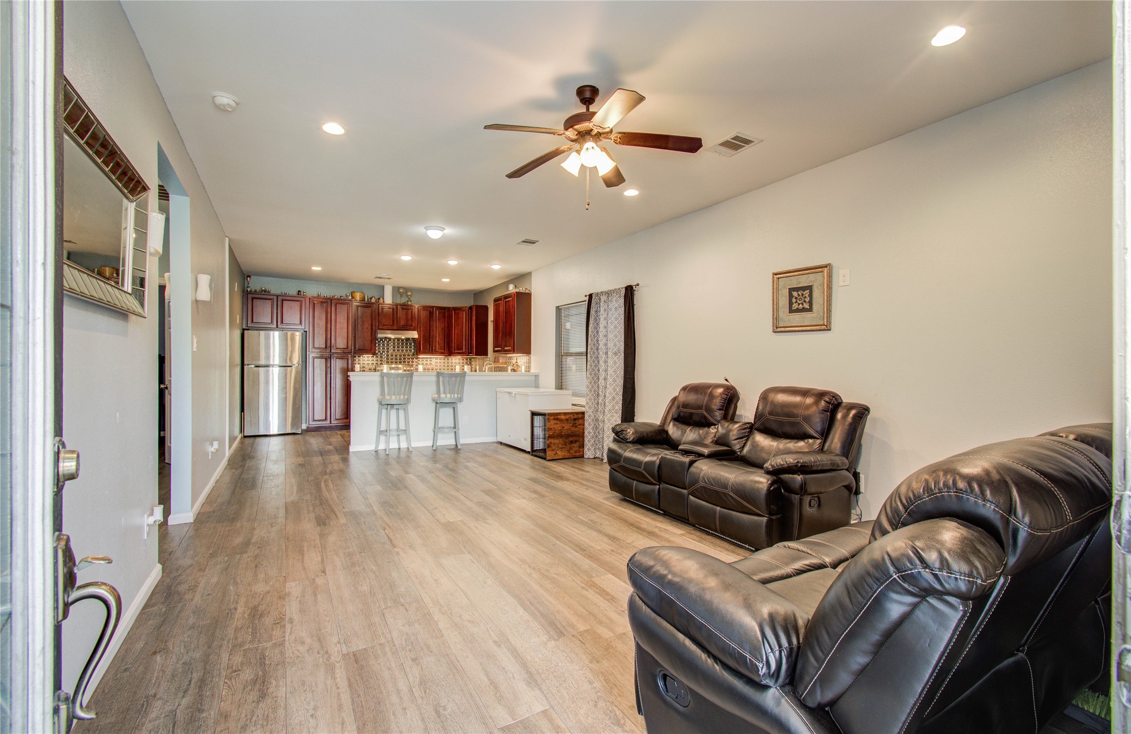 8040 Howton Street, Unit 12 Houston, TX 77028 - Photo 19 of 35 a living room with furniture and a wooden floor