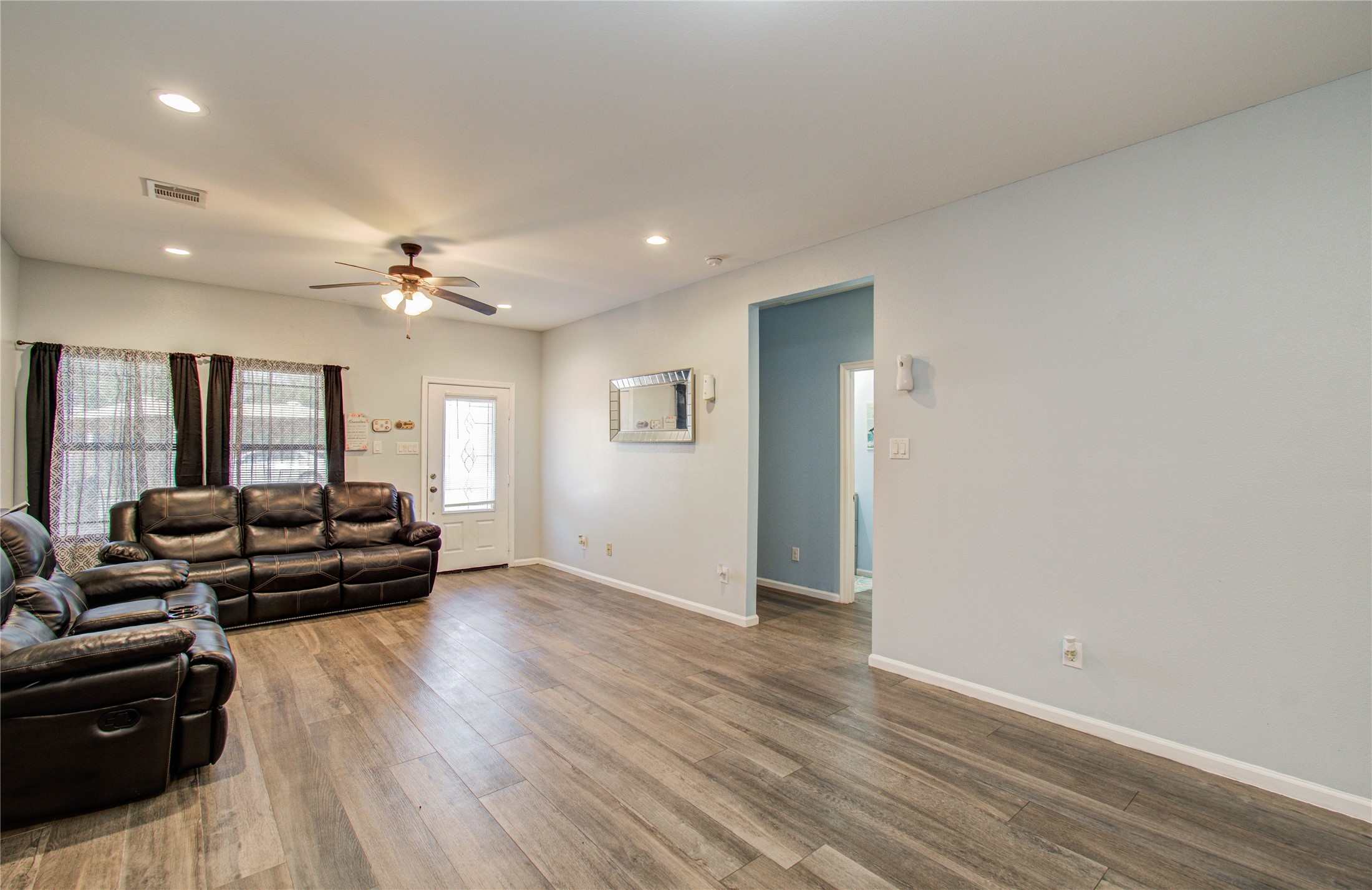8040 Howton Street, Unit 12 Houston, TX 77028 - Photo 22 of 35 a living room with furniture and wooden floor