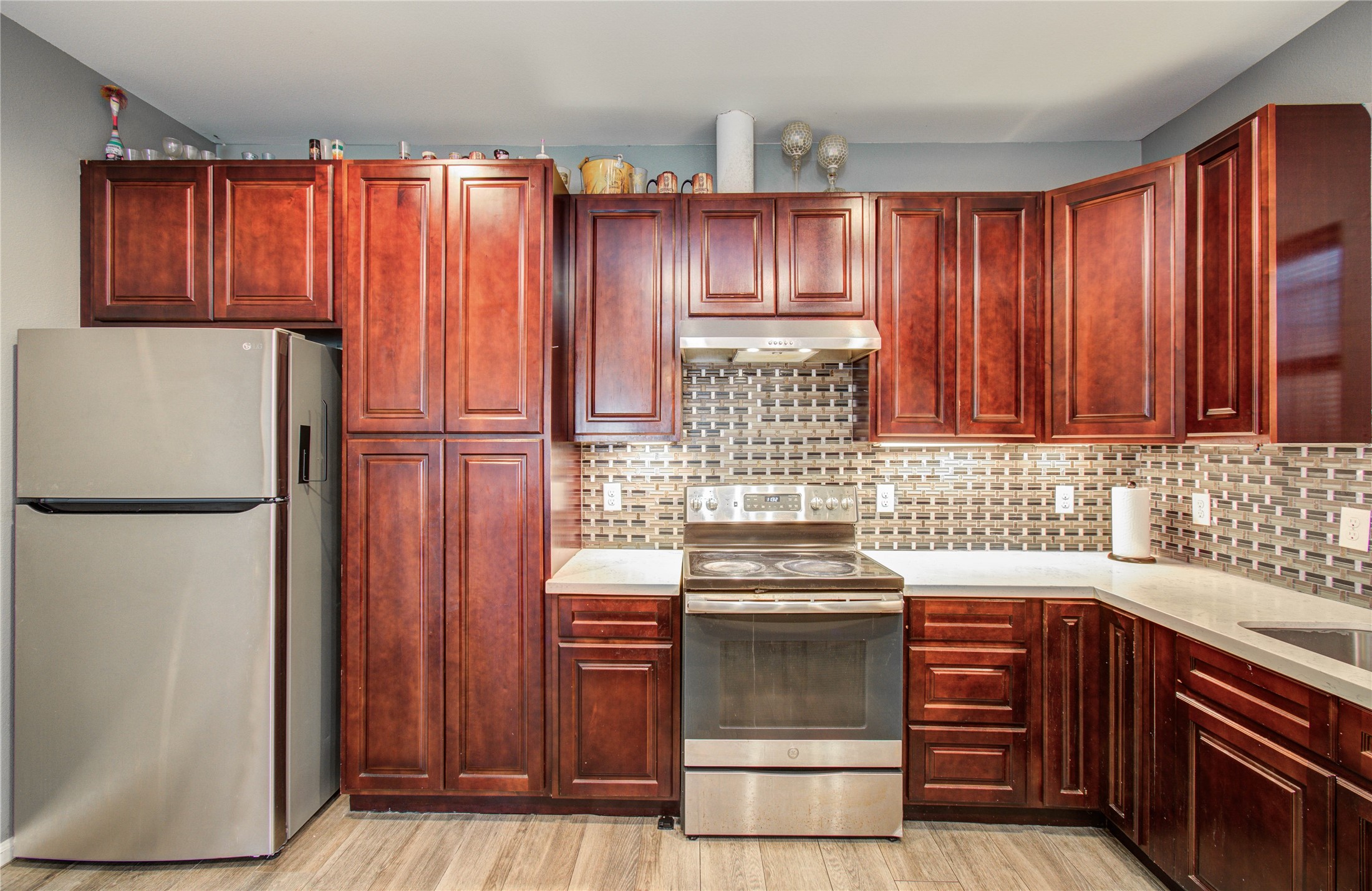 8040 Howton Street, Unit 12 Houston, TX 77028 - Photo 25 of 35 a kitchen with stainless steel appliances granite countertop a refrigerator and a sink
