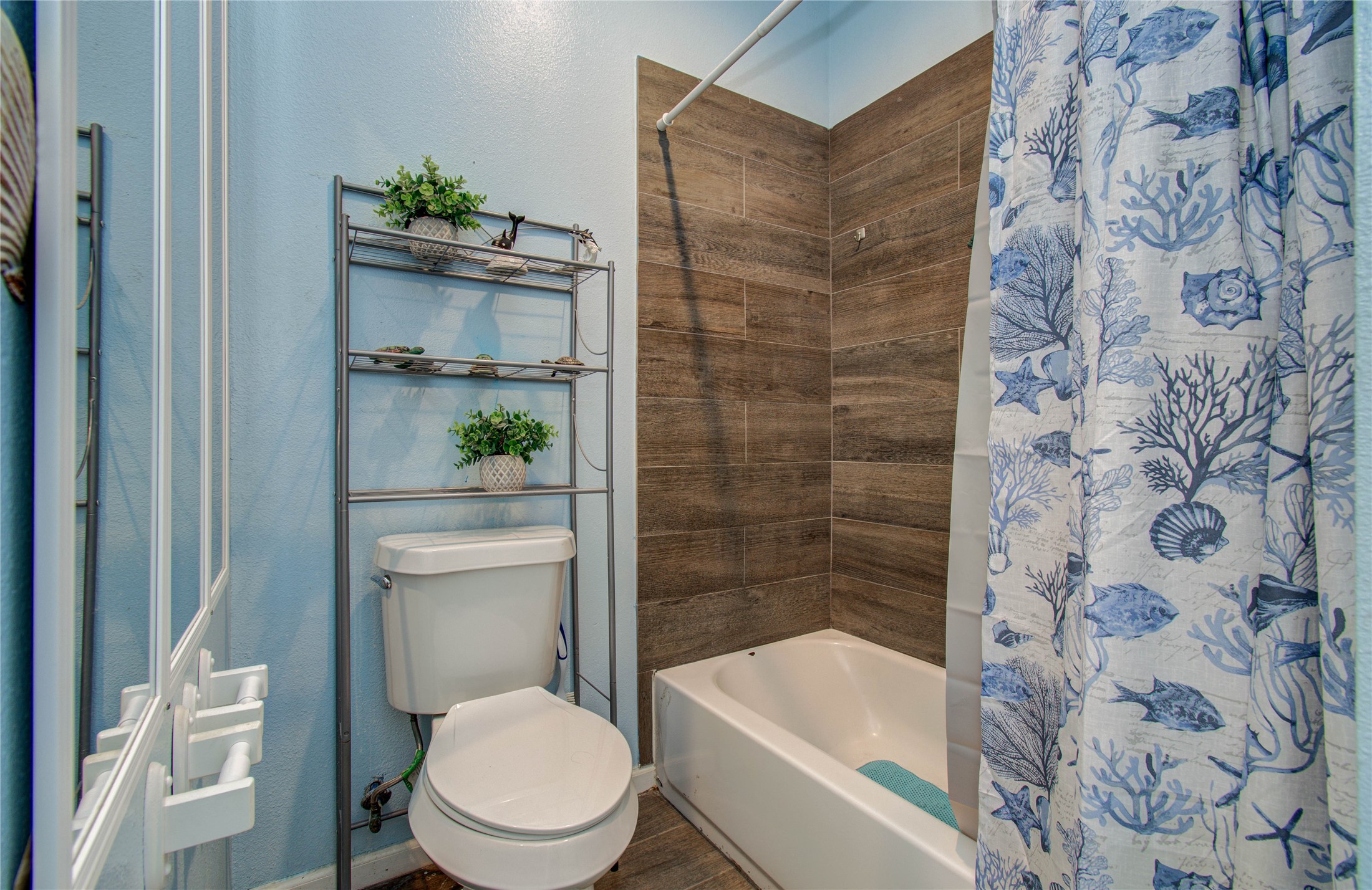 8040 Howton Street, Unit 12 Houston, TX 77028 - Photo 28 of 35 a white toilet sitting next to a bath tub