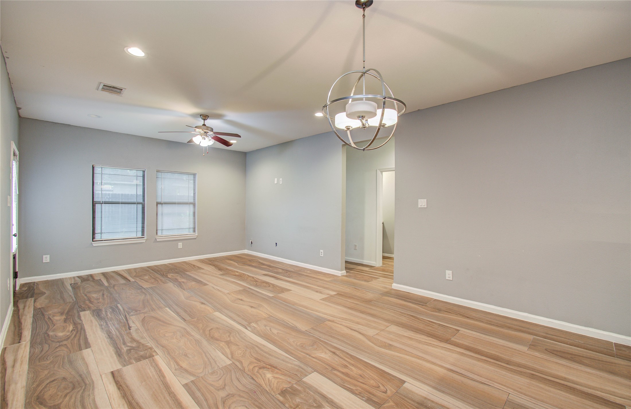 8040 Howton Street, Unit 12 Houston, TX 77028 - Photo 8 of 35 a view of empty room with wooden floor
