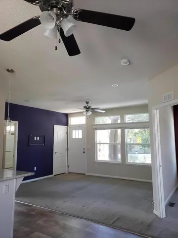 a kitchen with stainless steel appliances granite countertop a refrigerator sink and cabinets