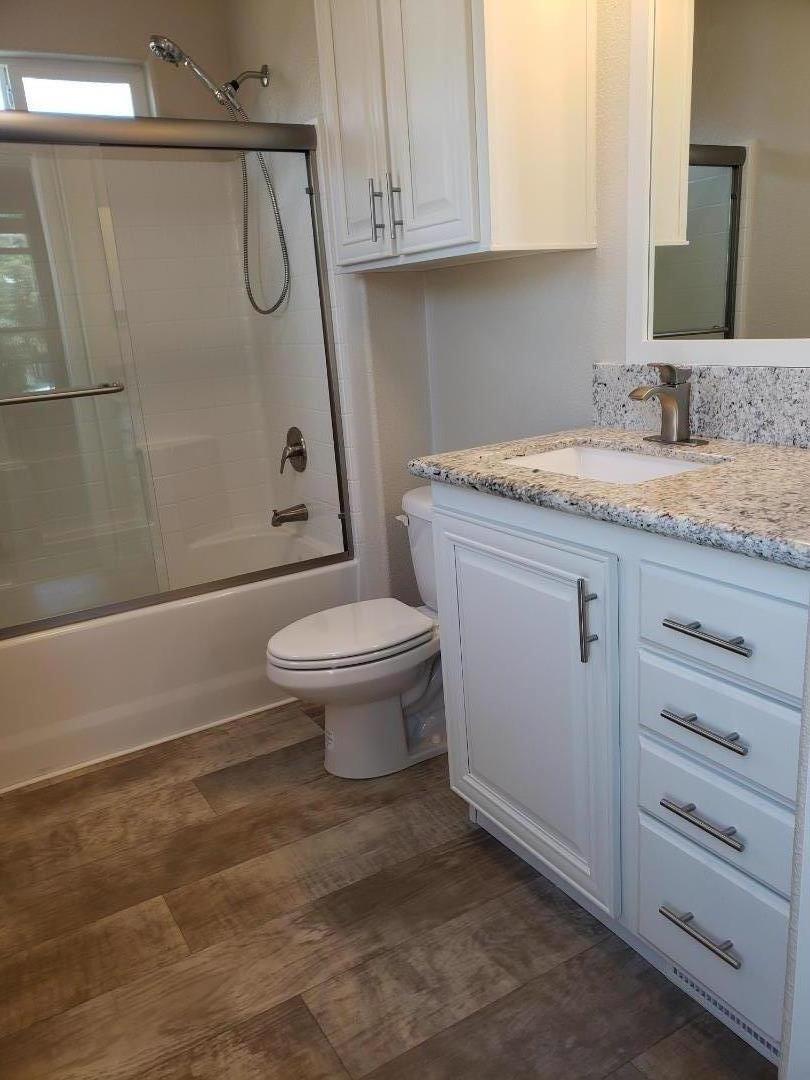 440 Moffett Boulevard, Unit 84 Mountain View, CA 94043 - Photo 24 of 38 a bathroom with a granite countertop sink toilet and shower