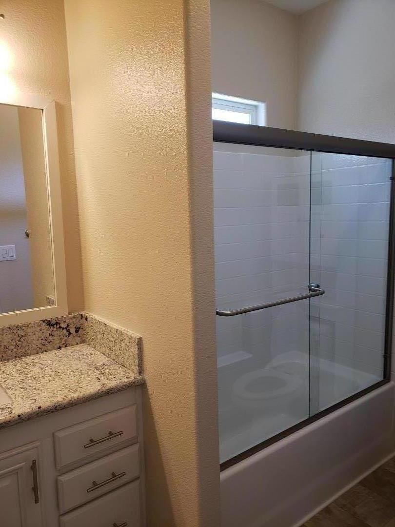 440 Moffett Boulevard, Unit 84 Mountain View, CA 94043 - Photo 29 of 38 a bathroom with a granite countertop sink and a mirror