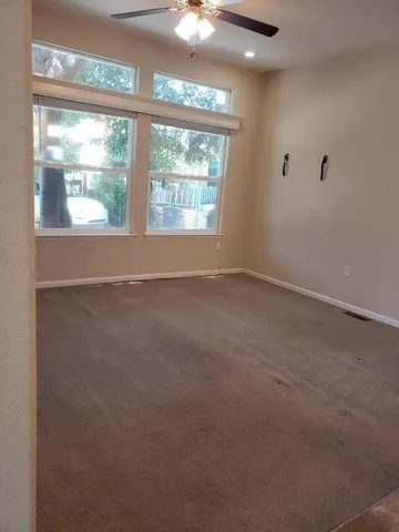 a view of a balcony with a tree