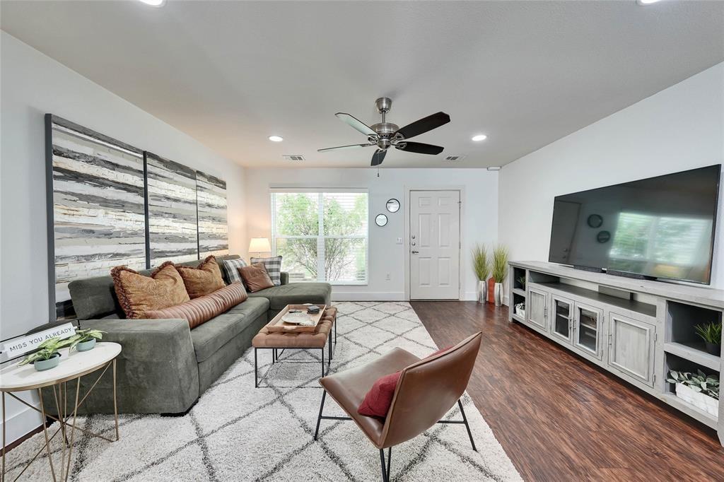 1101 Grove Boulevard, Unit 608 Austin, TX 78741 - Photo 3 of 17 a living room with furniture and a flat screen tv