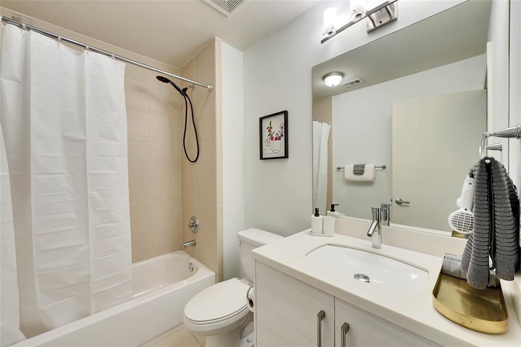 1101 Grove Boulevard, Unit 608 Austin, TX 78741 - Photo 9 of 17 a bathroom with a sink toilet and shower