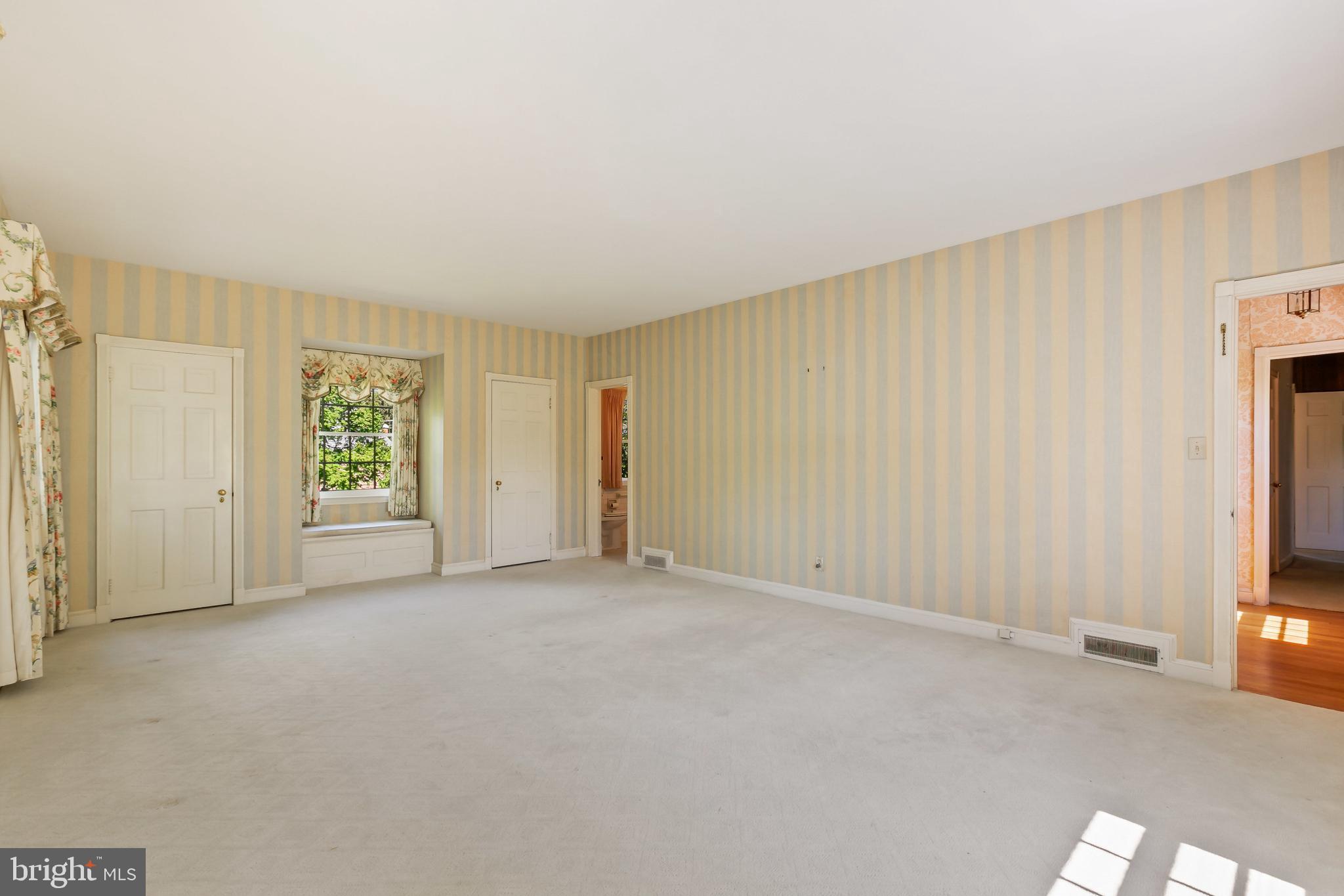 6405 Murray Hill Road Baltimore, MD 21212 - Photo 24 of 34 Hardwood under carpet in primary bedroom