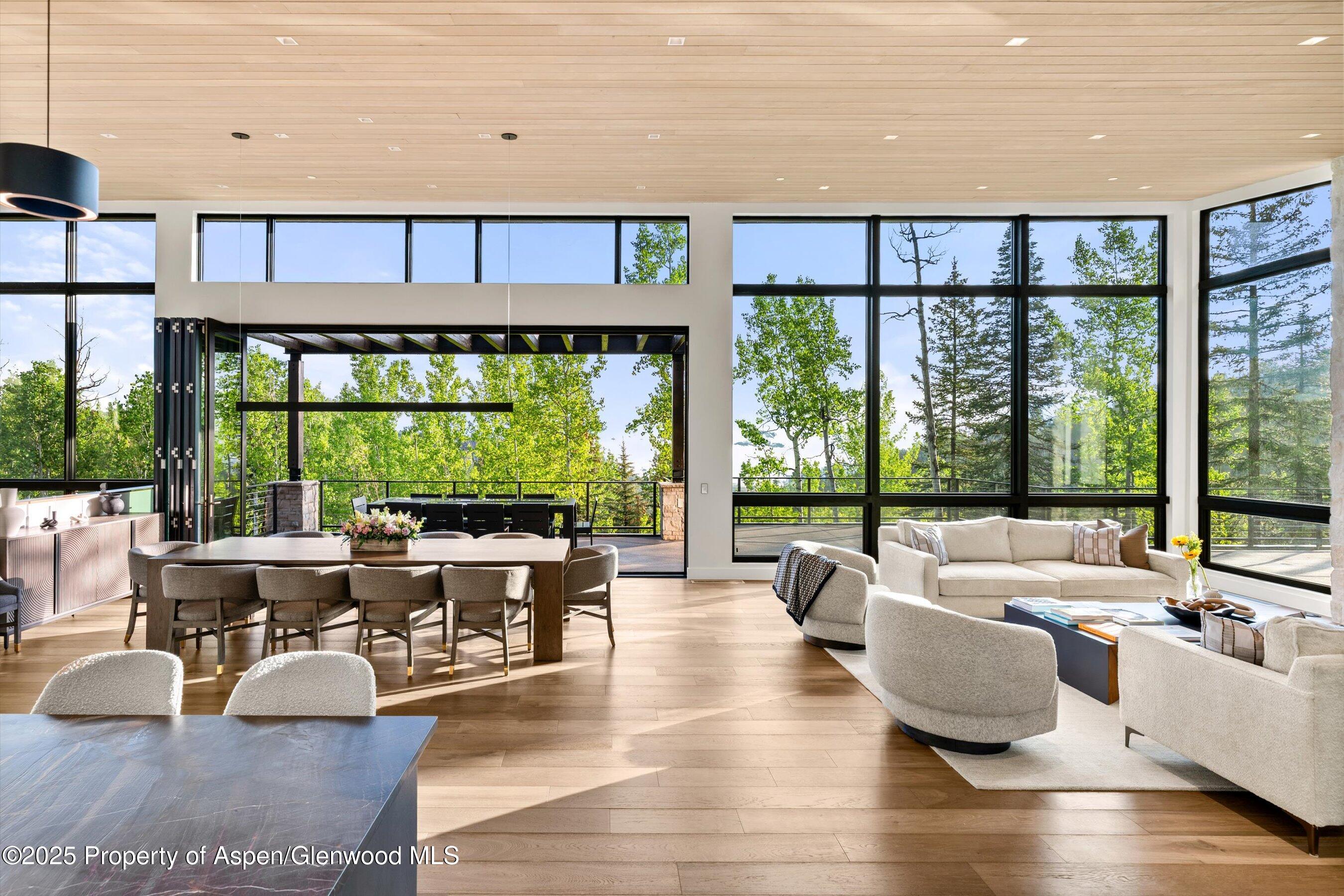 1234 Wood Road Snowmass Village, CO 81615 - Photo 18 of 66 a living room with furniture and large windows