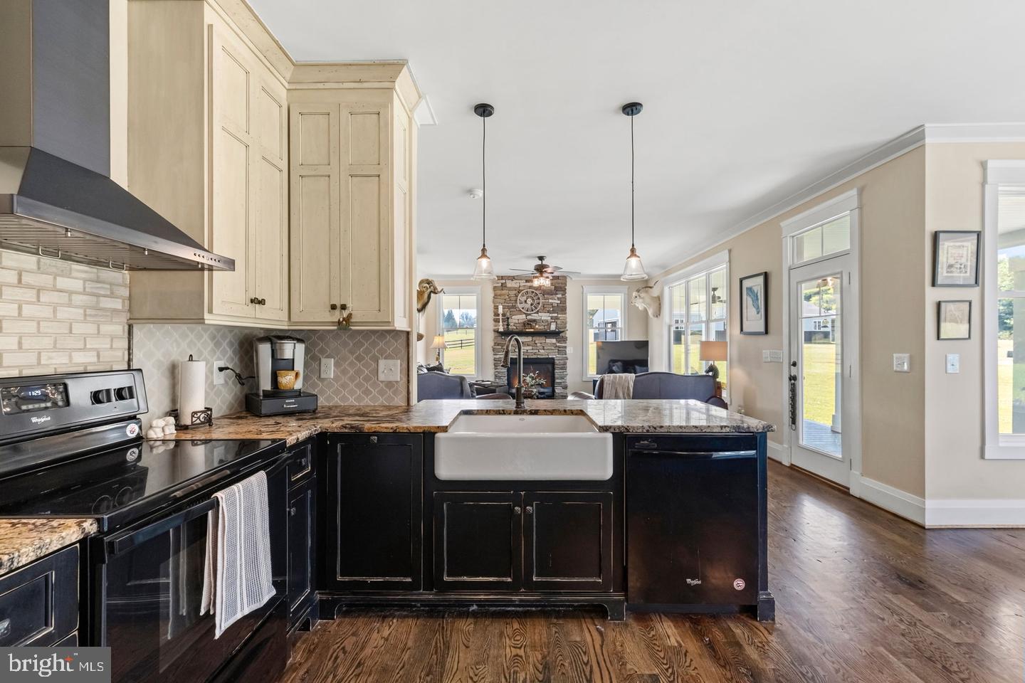 19113 Irby Spring Road Rockville, VA 23146 - Photo 43 of 75 Large farmhouse sink looks out to the family room
