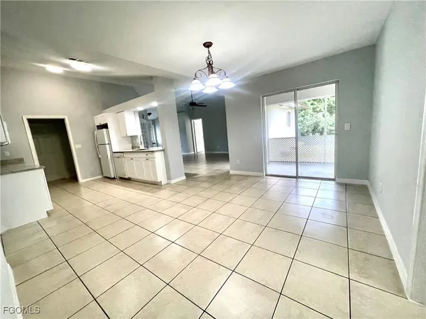 a view of a livingroom with kitchen