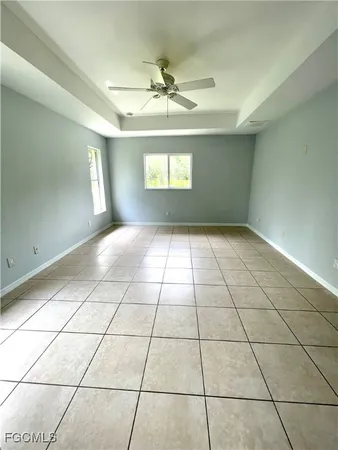a bathroom with a granite countertop sink a mirror and a bathtub