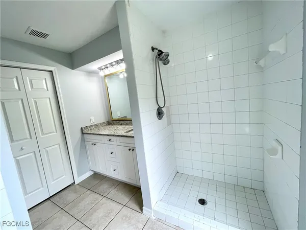a bathroom with a bathtub and shower