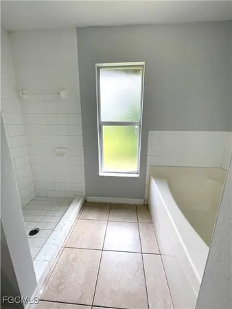 a bathroom with a toilet a sink and a mirror