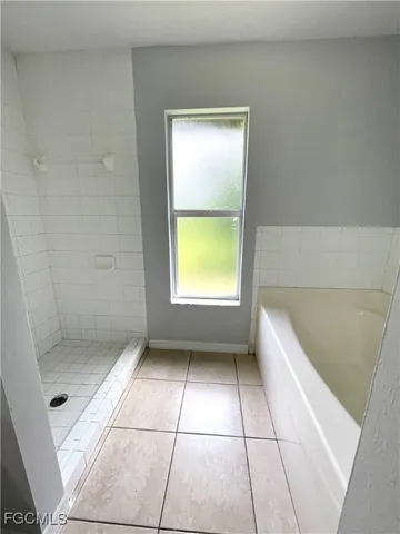 a bathroom with a toilet a sink and a mirror