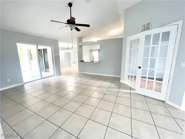 a view of an empty room with a window