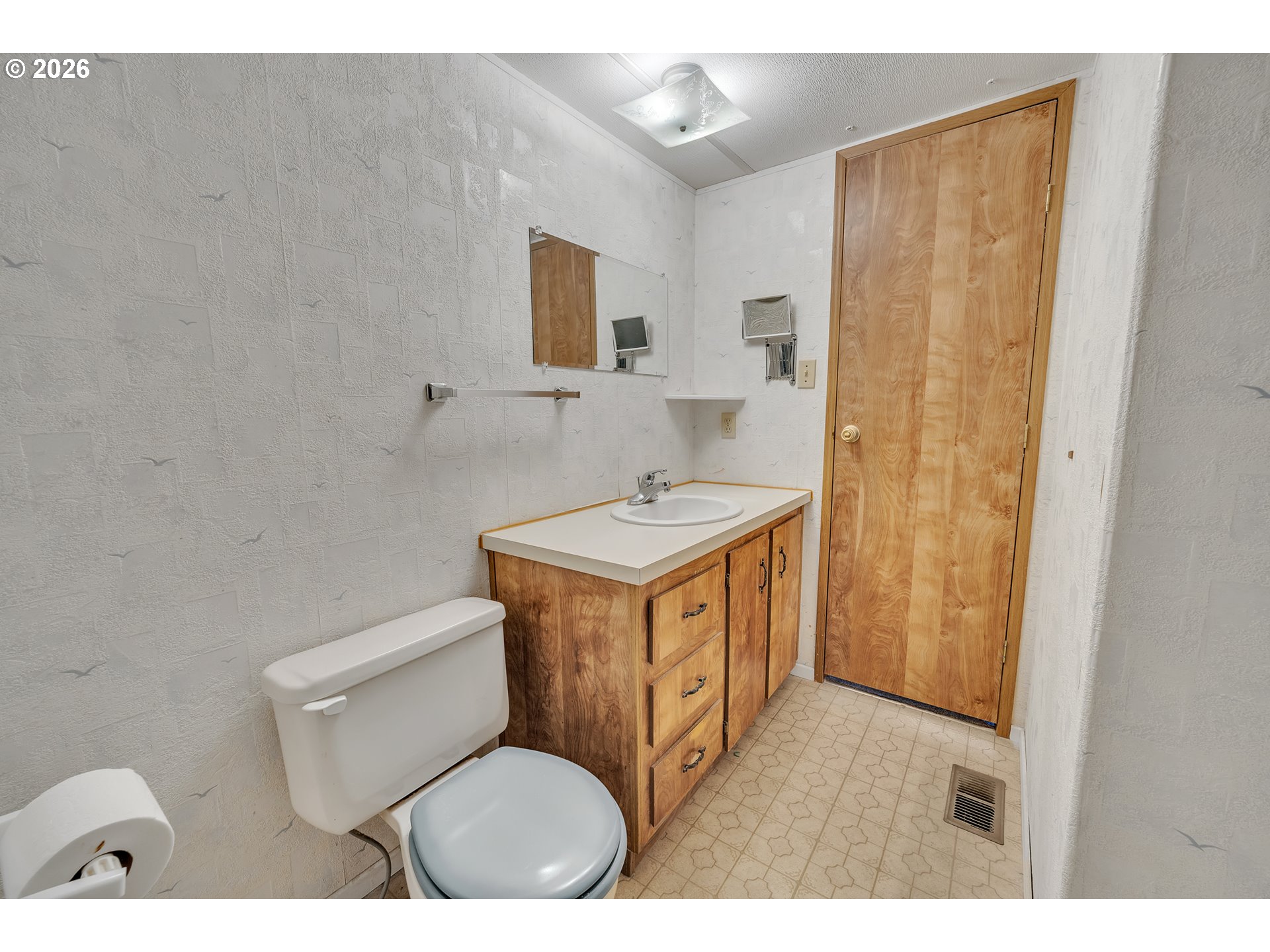 3137 Rainbow Loop Hubbard, OR 97032 - Photo 25 of 27 a bathroom with a sink toilet and mirror