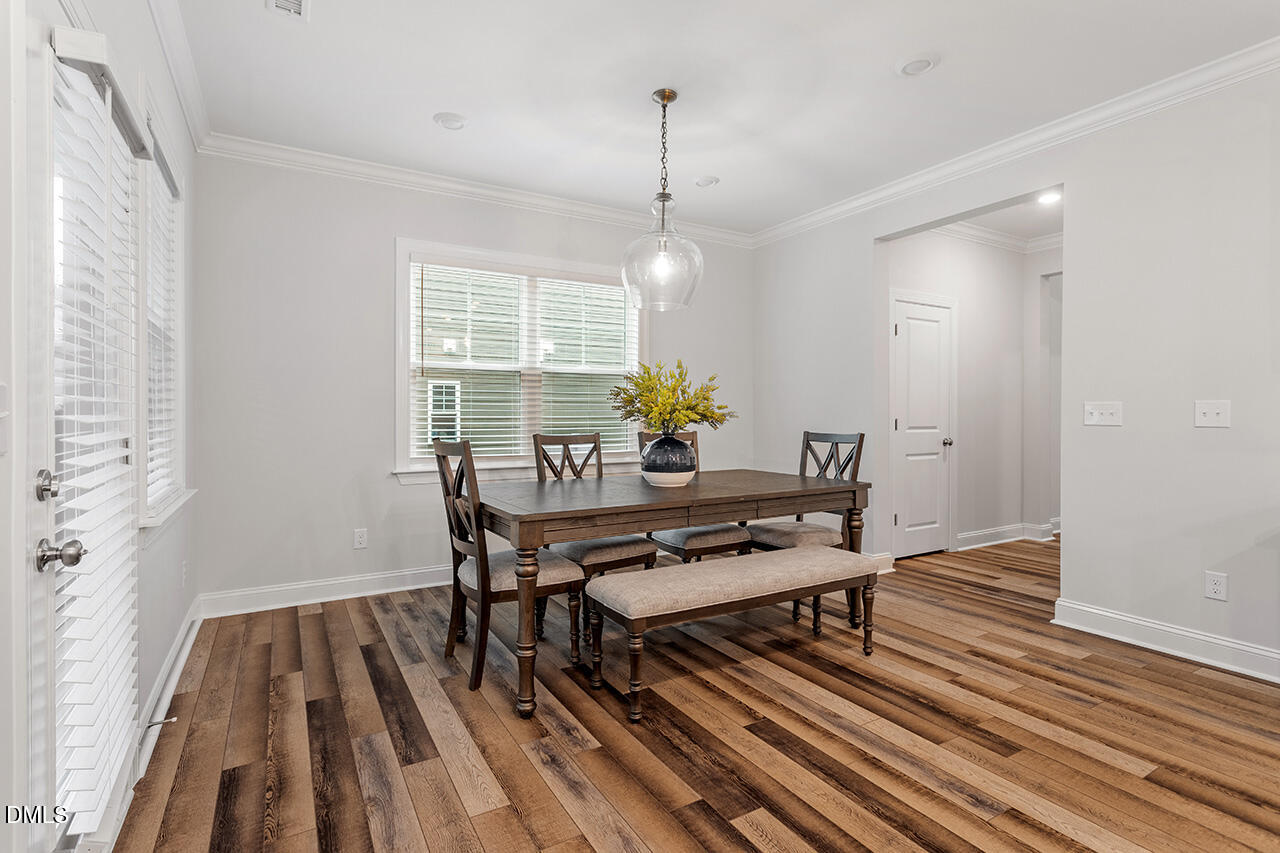 3932 Mount Moran Road Raleigh, NC 27616 - Photo 21 of 40 a view of a livingroom with furniture window and wooden floor